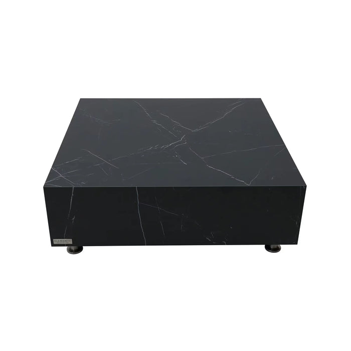 A low, square coffee table made of black marble porcelain with subtle white veining. It rests on small, dark, round feet.