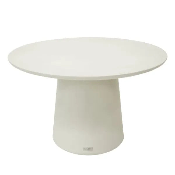 A close-up studio shot of a round, cream-colored Elementi Home Rio dining table with a smooth, minimalist design. The table has a thick, circular top and a wide, pedestal-style base.