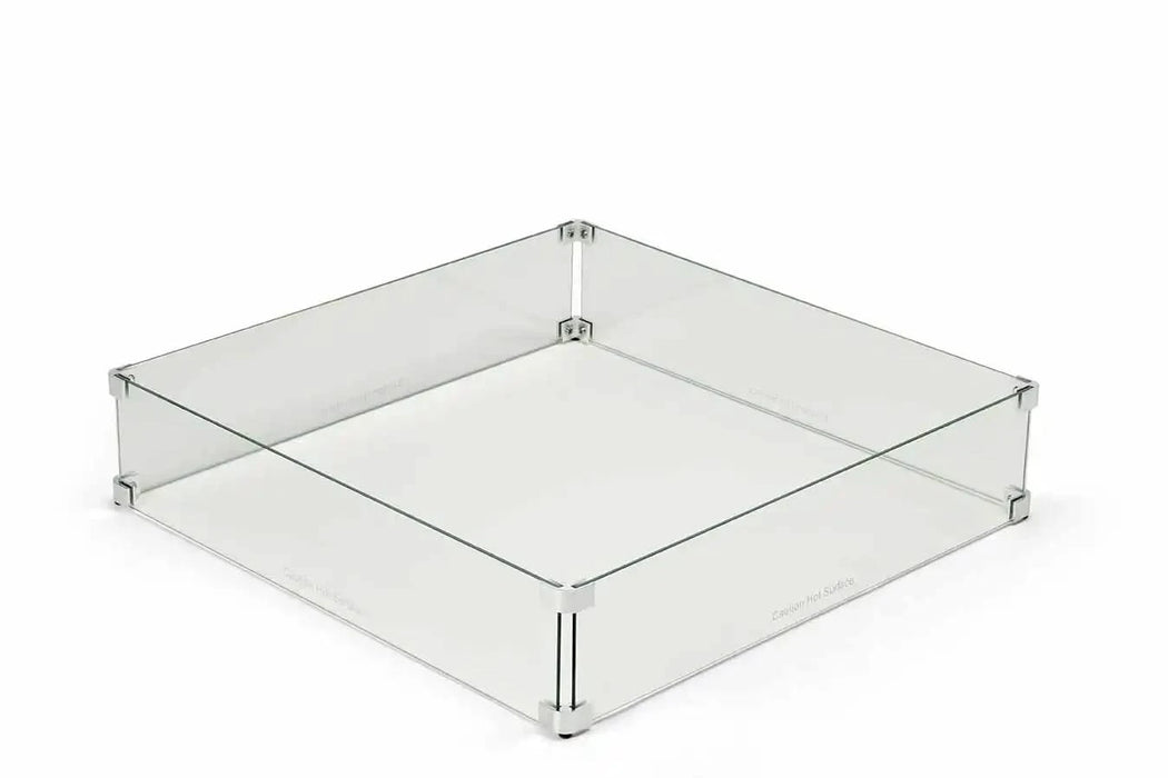 Square glass wind guard for a fire pit. The guard is made of clear tempered glass and has a polished aluminum frame. It is designed to protect the fire from wind and debris. The guard is easy to install and remove. The glass is 3/16 inch thick and can withstand high temperatures.