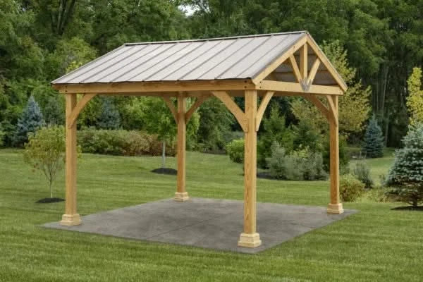 A wooden pavilion with an A-frame roof and bronze-colored steel roofing.