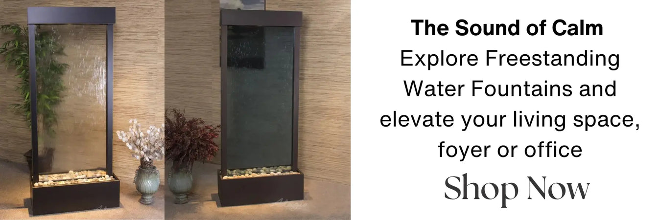 Two freestanding water fountains with dark frames and pebble bases against a textured wall.
