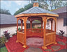 A wooden octagonal gazebo with a shingled roof and a decorative cupola. The gazebo features lattice detailing on the walls and a spacious interior with a brick floor.