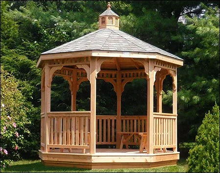 A wooden octagonal gazebo with a shingled roof, decorative cupola, and lattice detailing on the walls.