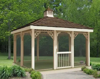 A large 10 ft by 10 ft rectangular screened gazebo with a peaked roof and decorative latticework. The gazebo has a double door with a small window and is surrounded by lush greenery.