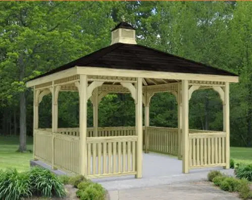 10 ft x 10 ft wooden gazebo with a peaked roof and decorative latticework. The gazebo stands on a concrete base surrounded by greenery.