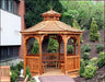 A wooden octagonal gazebo with a shingled roof and a decorative cupola. The gazebo features latticework detailing on the walls and a spacious interior with a built-in bench.