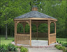 A large octagonal gazebo with a shingled roof, surrounded by greenery.