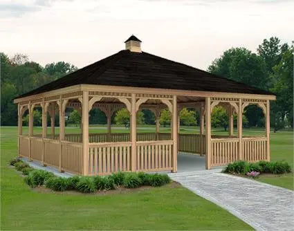 A large 16ft by 16ft square cedar gazebo with a double roof and decorative cupola. The gazebo features intricate latticework details, a spacious interior, and a surrounding picket fence.