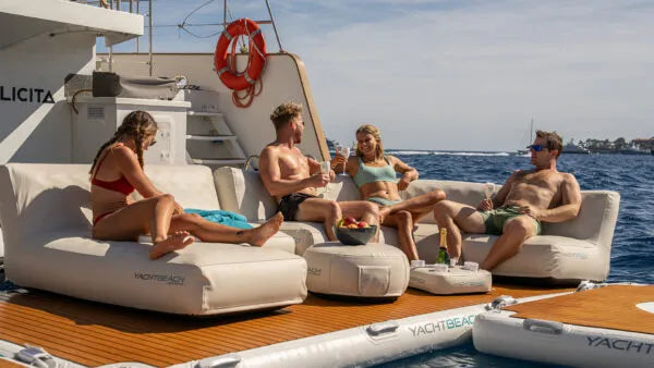Group of people relaxing on a yacht with a scenic background