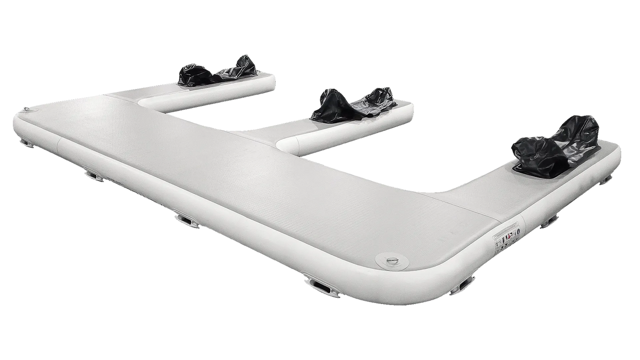 Inflatable boat with four ski boots attached on a white background