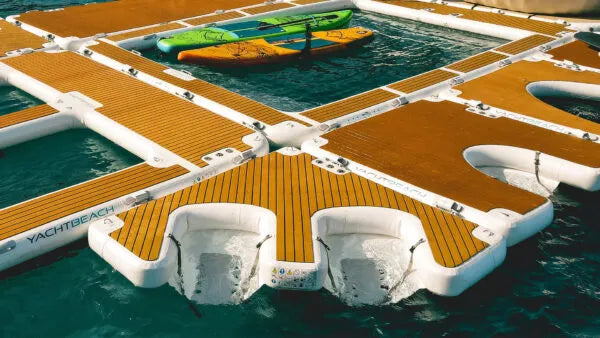 Floating dock with kayaks on a body of water