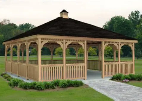 A large 20ft by 20ft square cedar gazebo with a double roof and decorative cupola. The gazebo features intricate latticework details, a spacious interior, and a surrounding picket fence.