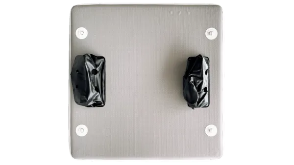 Metallic light switch plate with two black rocker switches on a white background