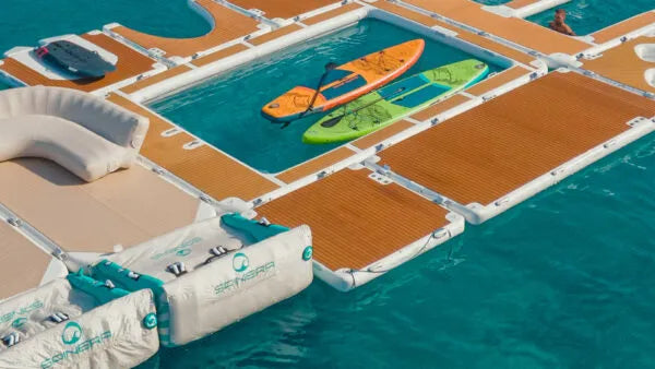 Floating dock with kayaks on a body of water
