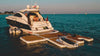 Luxury yacht with a floating platform on a calm blue sea