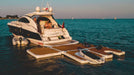 Luxury yacht with a floating platform on a calm blue sea