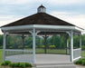 A white octagonal vinyl gazebo with a classic design. It features a shingled roof with a decorative cupola, white latticework railings, and built-in benches. Trees and shrubs frame the gazebo in the background.