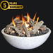 white fire pit bowl burning on a bed of lava rocks and fire pit logs. Fire pit bowl is in GFRC concrete with black accents. It is lit and letting out yellow and orange flames on a black background