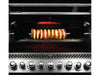 A stainless steel gas grill with a rotisserie cooking a skewer of meat and vegetables.