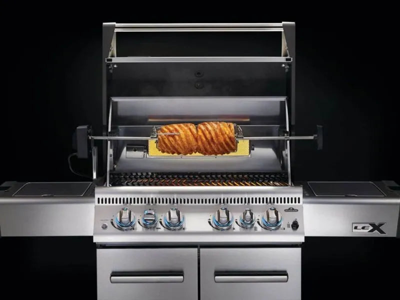 A stainless steel gas grill with a rotisserie kit cooking a roast by napoleon grill