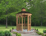 A wooden octagonal gazebo with a shingled roof, decorative cupola, and intricate latticework detailing on the walls and roofline.