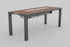 An angled front view of a bar-height outdoor grill table with a wood-slat top and a long, narrow built-in grill. The table has dark grey metal legs and two under-table compartments, with a small control panel visible on the left side.