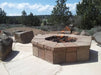 An octagonal fire pit with a black metal mesh screen, designed for safe and enjoyable outdoor fires.