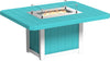 Square outdoor dining table made of weather-resistant turquoise material with a built-in fire pit and glass wind guard.