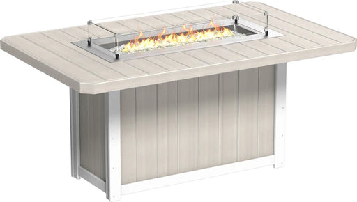 A white LuxCraft fire pit table with a propane-powered fire pit, tempered glass wind guard, and hidden propane tank storage.