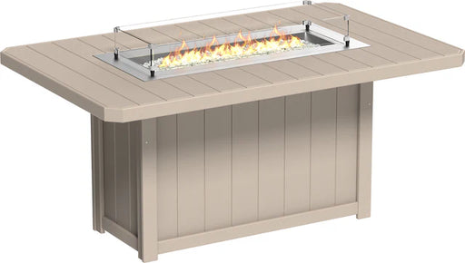 A LuxCraft fire pit table with a propane-powered fire pit, tempered glass wind guard, and hidden propane tank storage.