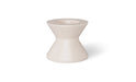 A beige, round poolside table with a wide base and a slightly tapered top.