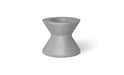 A grey, round poolside table with a wide base and a slightly tapered top.