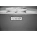 Gray appliance with 'Elementi' brand logo on a blurred background