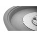 Close-up of a metallic circular object with a central feature on a white background