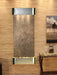 Wall mounted water feature by adagio with decorative elements in a room setting