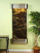adagio water feature with a stainless steel trim and hood on a green marble slate