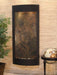 Decorative wall fountain by adagio water features with textured panel on a beige wall