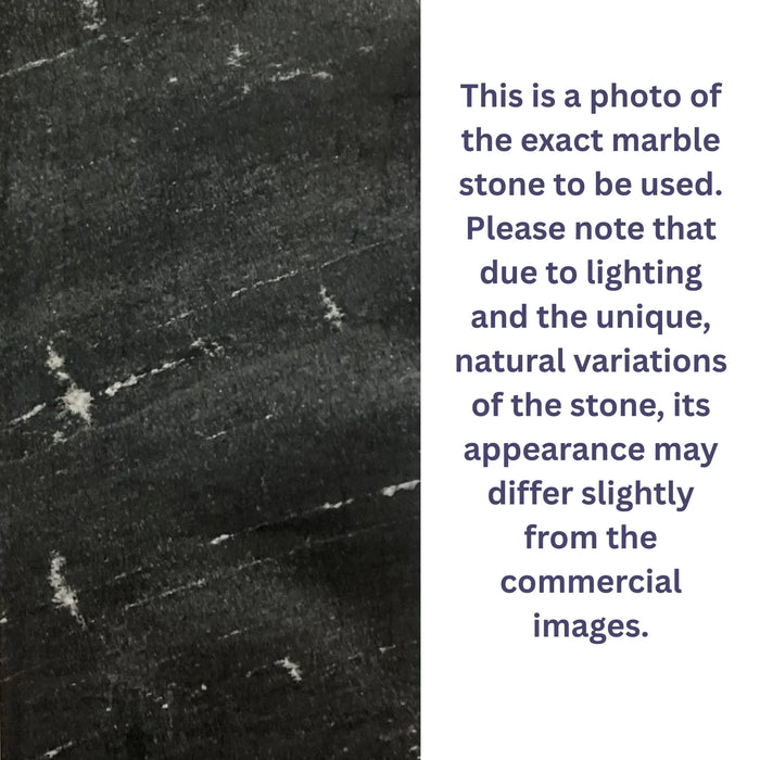 Close-up of a marble stone of an indoor wall fountain with text explaining lighting and natural variations.