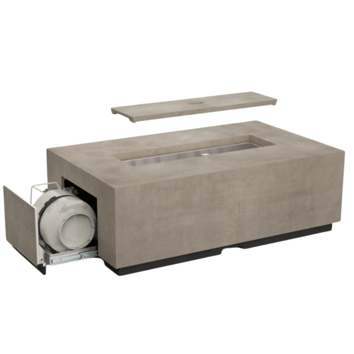 A rectangular fire table made of concrete with a drawer open revealing a propane tank inside.