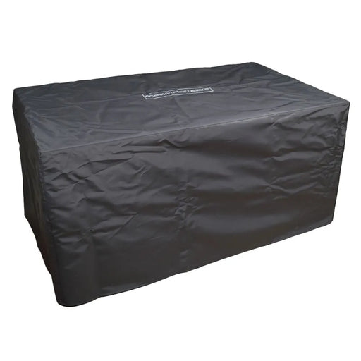 A black fabric rectangular fire pit cover with the "American Fyre Designs" logo visible in a white rectangle on the top. The cover is shown on a white background, angled slightly to the right, revealing its rectangular shape and fabric texture.