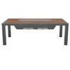 A rectangular outdoor dining table with a wood-slat top and a central built-in grill, supported by dark grey metal legs.
