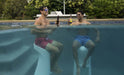 two friends enjoying drinks while sitting on bar height swimming pool stools in side the bool