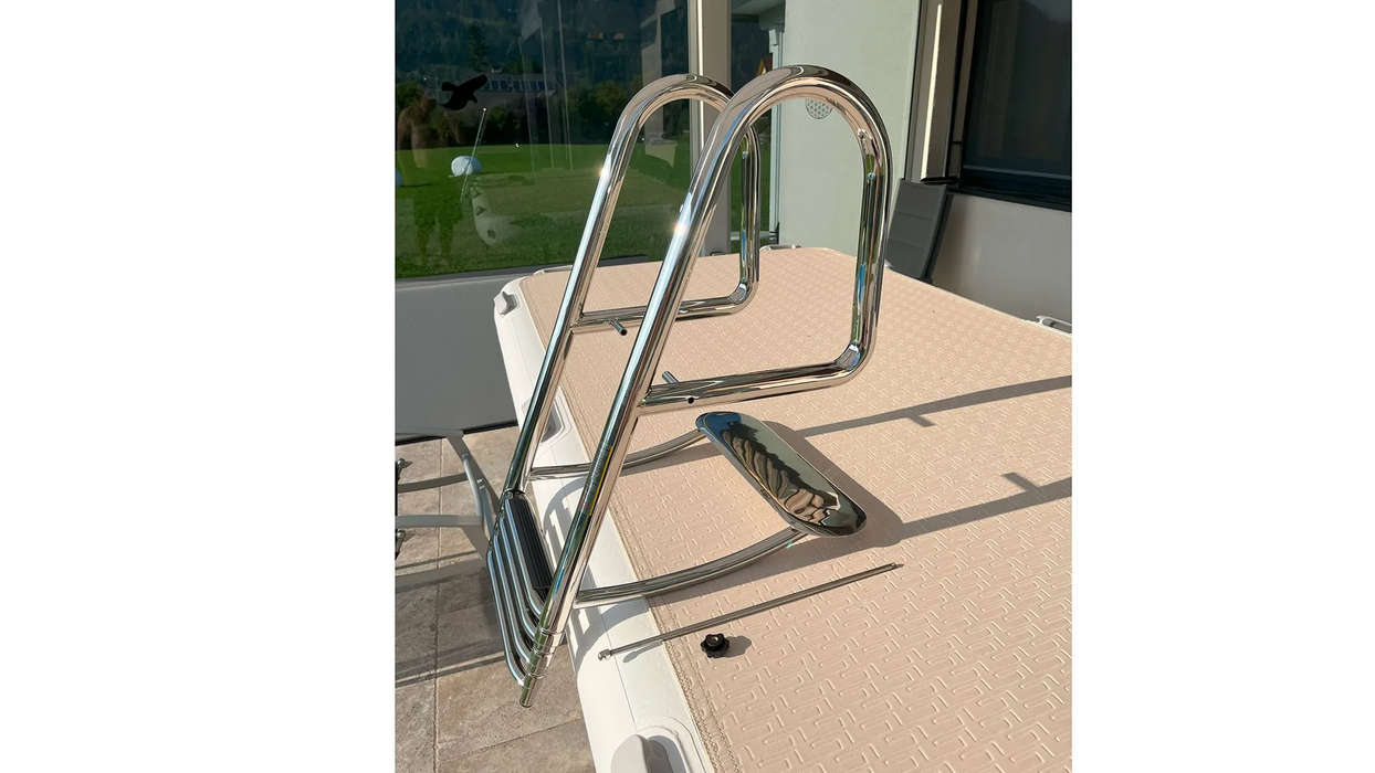 Metal boarding boat ladder on a boat with a glass door in the background