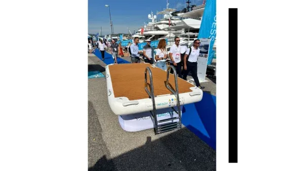 Inflatable dock with boat ladder on display at an outdoor event
