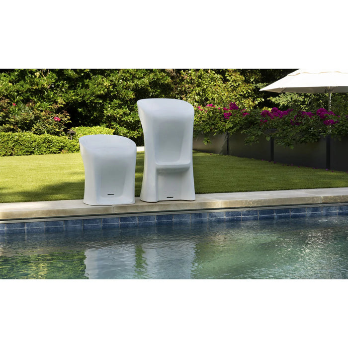 A photo showcasing two Ledge Lounger Signature stools in white. One is bar height and the other is a normal chair height