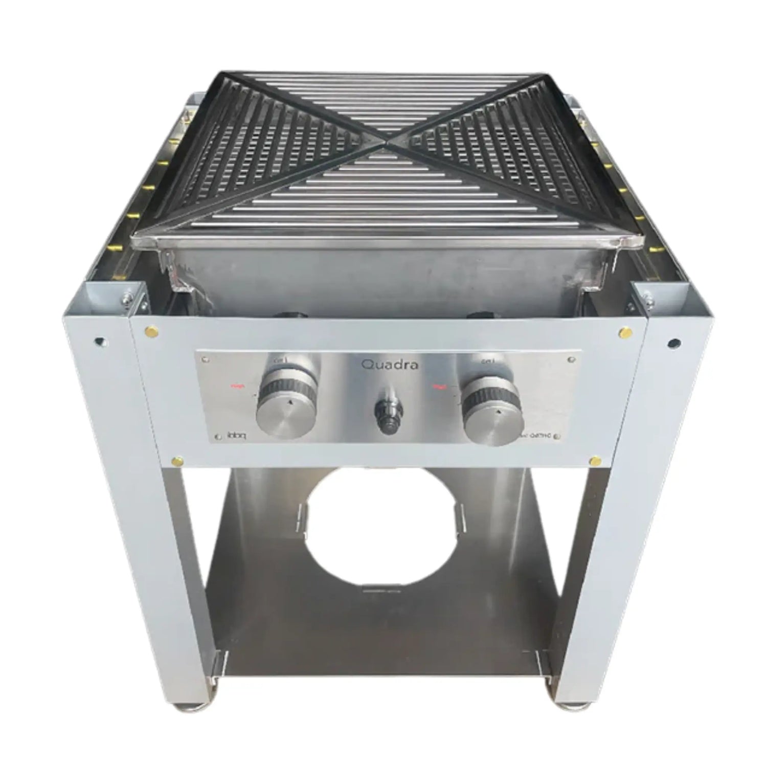 An overhead, slightly angled view of a silver-grey metal grill frame, designed to be built into a table. The unit features a square, pyramid-shaped grilling grate on top, and a front panel with "Quadra" branding, two prominent control knobs, and a central ignition switch. An open circular cutout is visible in the base, and small "iBBQ" branding is also present on the front panel. The background is solid white.