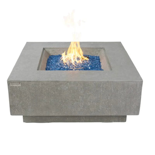 light grey textured fire pit table with blue fire glass on a white background