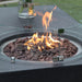 round fire pit on a rectangle fire table. Round fire glass protecting fire flame