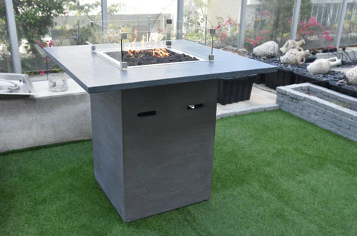 elementi alps bar height fire pit table OFG222 light grey with windscreen on grass patio