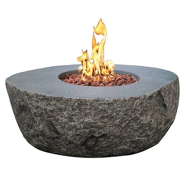 elementi boulder rock fire pit table ofg110 with flame on white background. fire pit is lit on red lava rocks